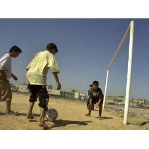  Iraqi Boys Play Soccer in a Baghdad Neighborhood 