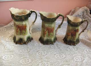 up for sale are 3 very old china pitchers with