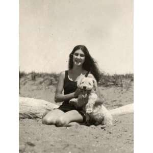  A Girl in Her Swimsuit on the Beach with Her Dog, Italy 