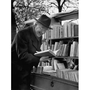 Dr. Edwin Redslob, Buying Books at a Bookstand Across the Street from 