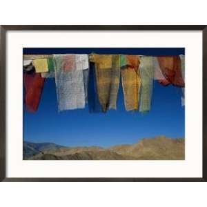  A Line of Multi Colored Prayer Flags Sway in the Gentle 