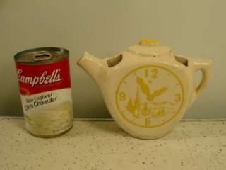 Vintage Ceramic Tea Pot Wall Pocket with gold clock and a couple going 