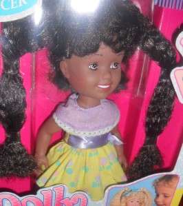 Make Dolls hair long or short for styling fun. Raise her right arm 