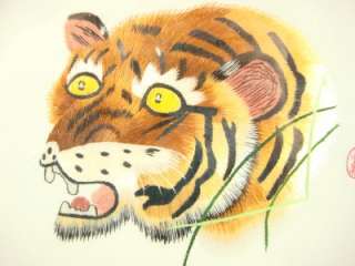 tigers face, in rotating frame, round with plastic cover, cherry wood 