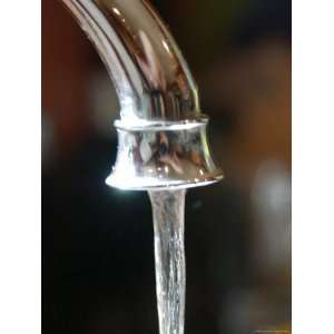  Water Flows Out of a Stainless Steel Faucet, Chevy Chase, Maryland 