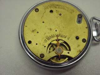   clock with watch movement that can be removed and used as an open face