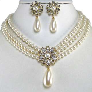 stunning multi strand cream glass pearls with single dangled teardrop