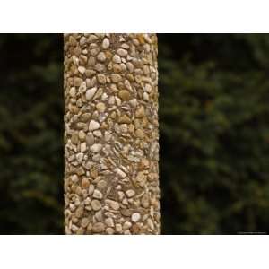  Close up of a Round Pole of Concrete with Embedded Pebbles 