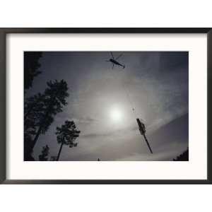Helicopter Lifts Cut Timber from the Forest; Helicopter Logging is 