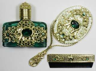   Filigree set includes a perfume bottle, a hand mirror and a comb