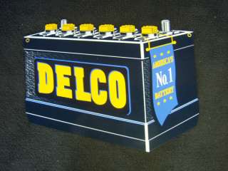 DELCO BATTERY BLACK WITH GOLD CAPS VINTAGE SIGN  