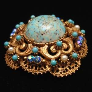   pin with rhinestones and large aqua art glass cab. Safety clasp