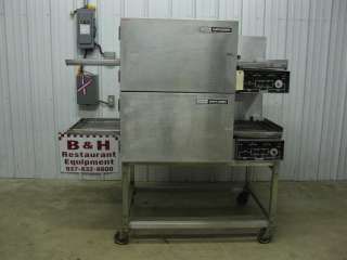   at a Lincoln Impinger electric double stack conveyor pizza oven