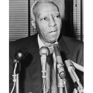  1964 photo Asa Philip Randolph, behind microphones during 