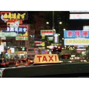  Taxi Sign and Neon Lights at Night on Nathan Road, Kowloon 