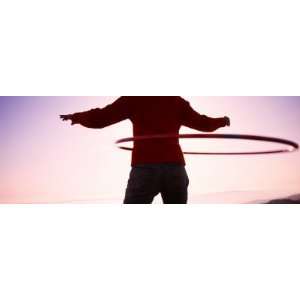  Woman with Hula Hoop in Silhouette, California, USA 