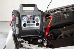 The Peak PKC0BK Portable Power System 450 Plus being used to jump 