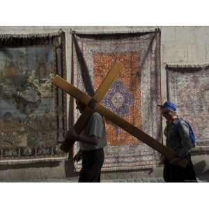 Couple of Pilgrims Carrying a Cross on the Via Dolorosa During Good 